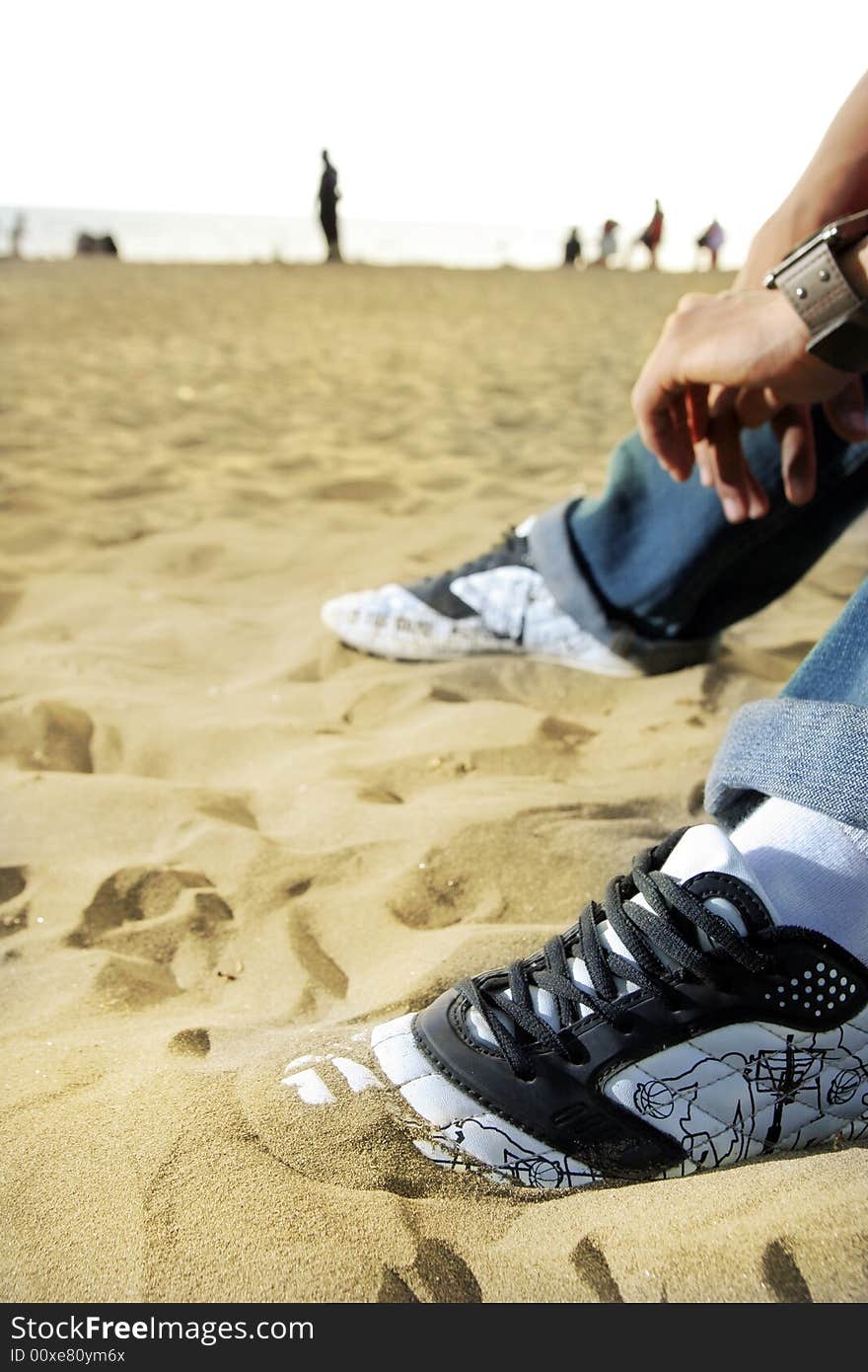 Foot on the beach sand