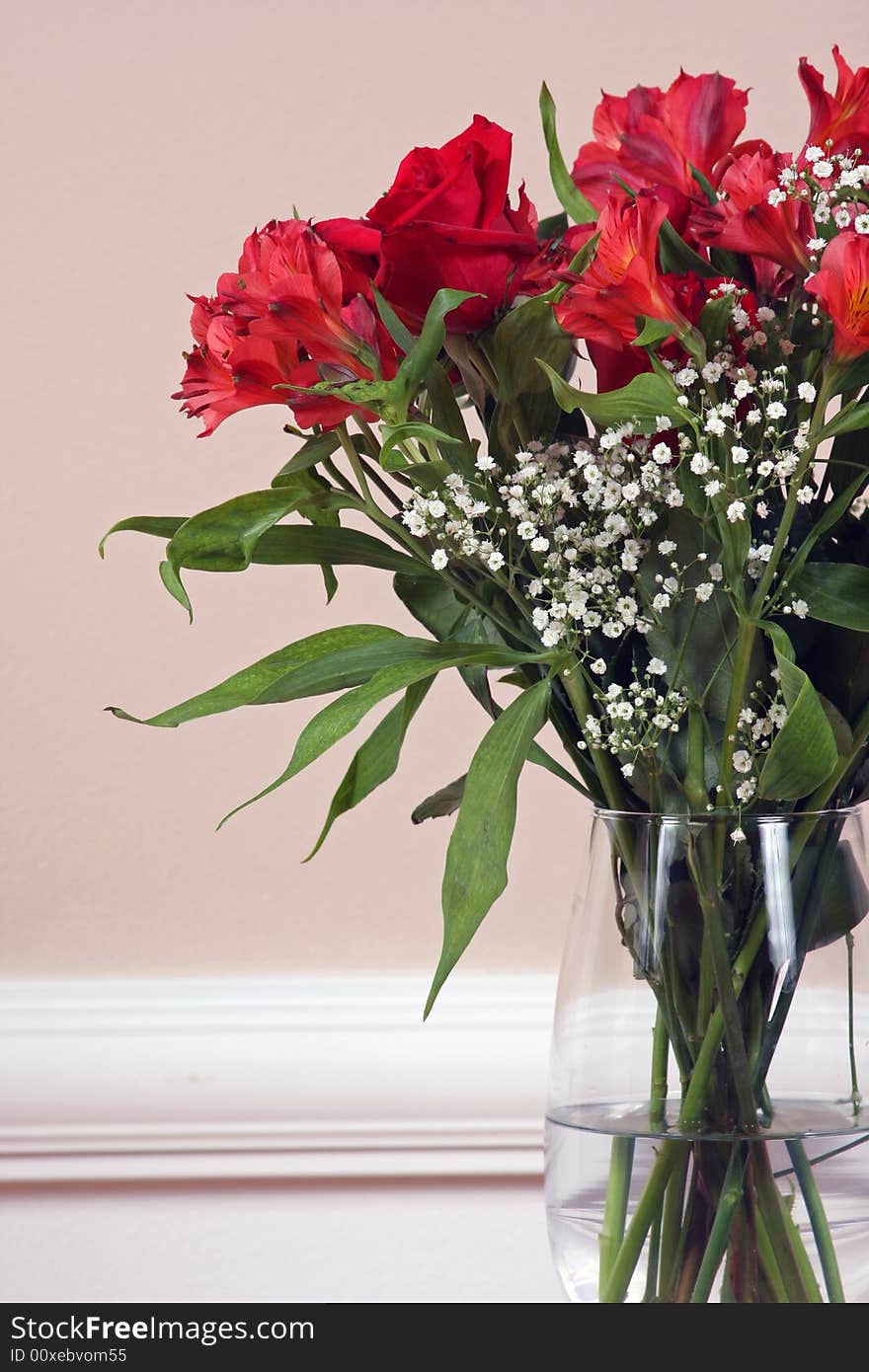 Roses and Alstroemeria in a crystal vase. Roses and Alstroemeria in a crystal vase.