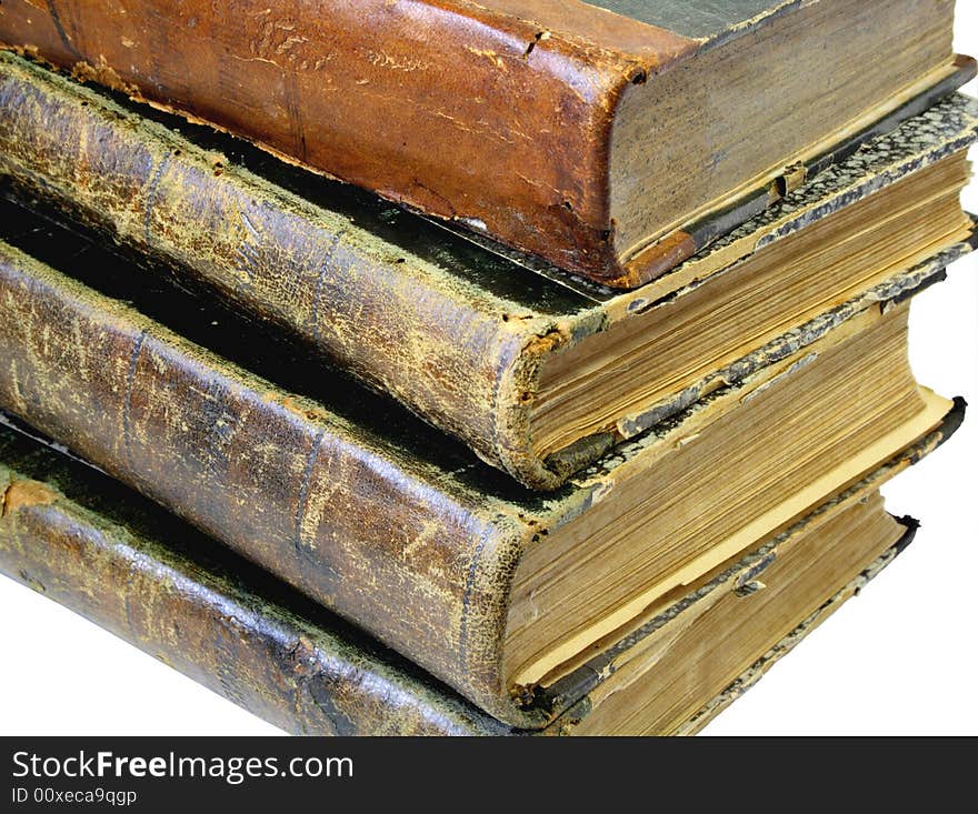 Pile from four old yellowed books on a white background. Pile from four old yellowed books on a white background.