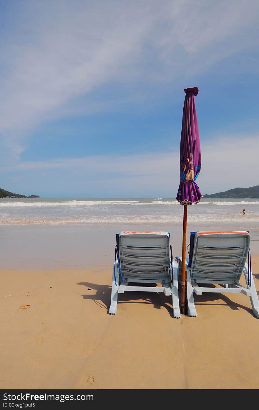 Beach chairs and umbrella