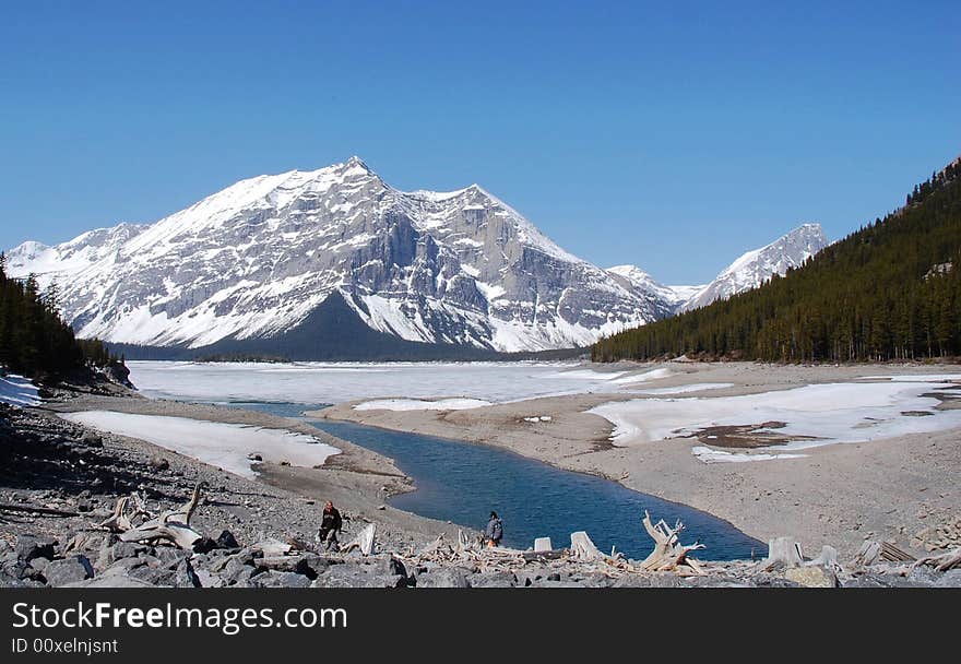 Spring view of alpine lake and surrounding mountains, kananaskis, alberta, canada. Spring view of alpine lake and surrounding mountains, kananaskis, alberta, canada