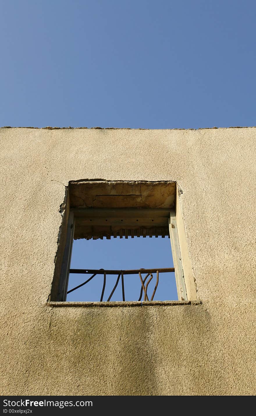 An old wall with a frame window. An old wall with a frame window