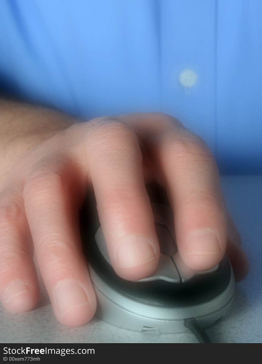 Soft focus applied to man using computer mouse. Soft focus applied to man using computer mouse