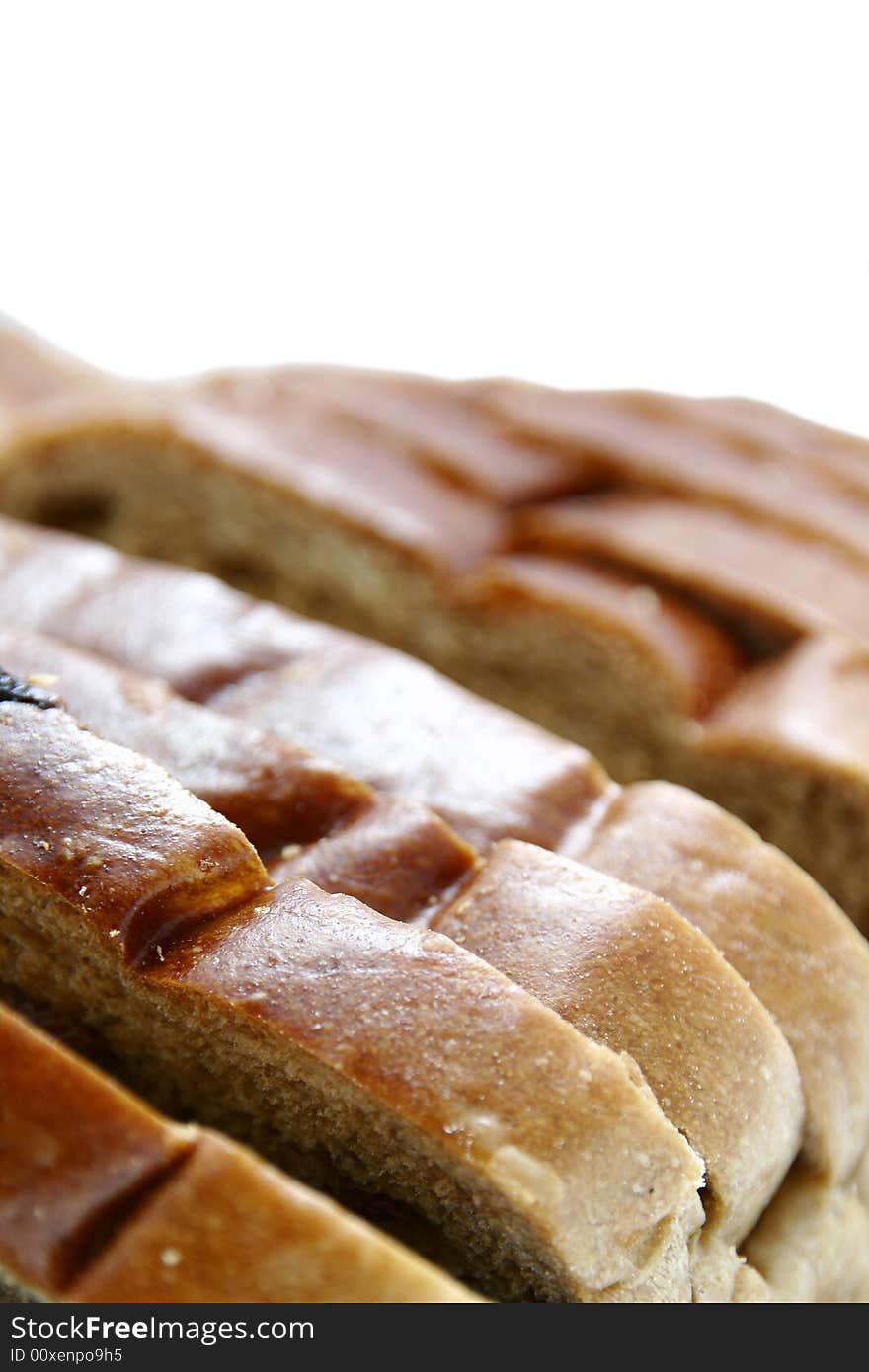 A partial view of a loaf of bread.