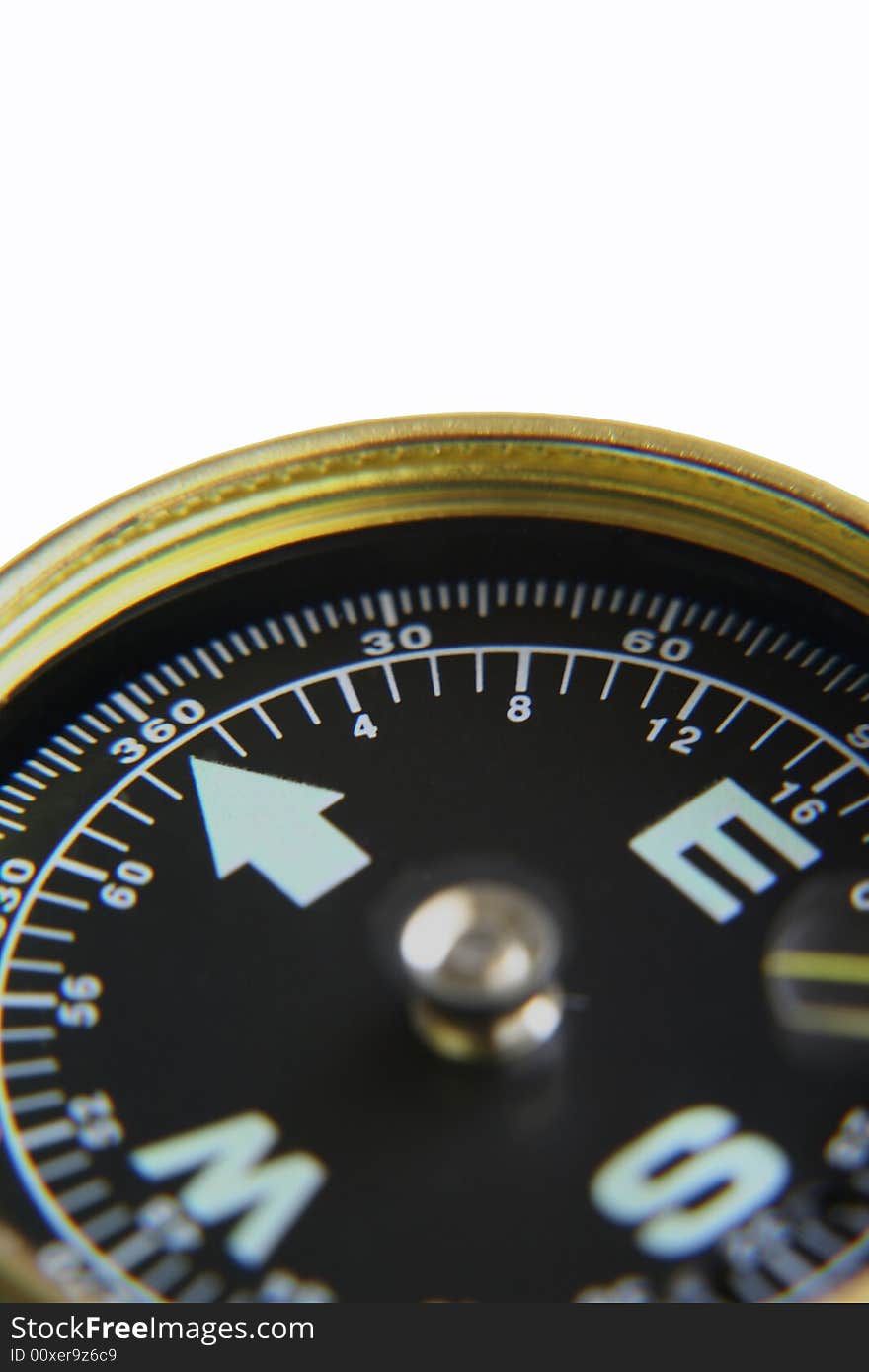 A partial view of a direction compass. A partial view of a direction compass.