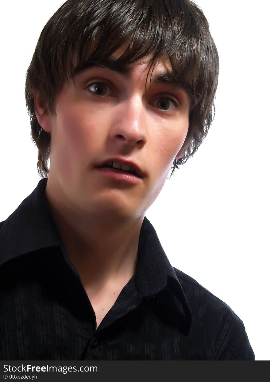 A portrait about a trendy attractive young guy who is looking towards and he is surprised. He is wearing a stylish black shirt. A portrait about a trendy attractive young guy who is looking towards and he is surprised. He is wearing a stylish black shirt.