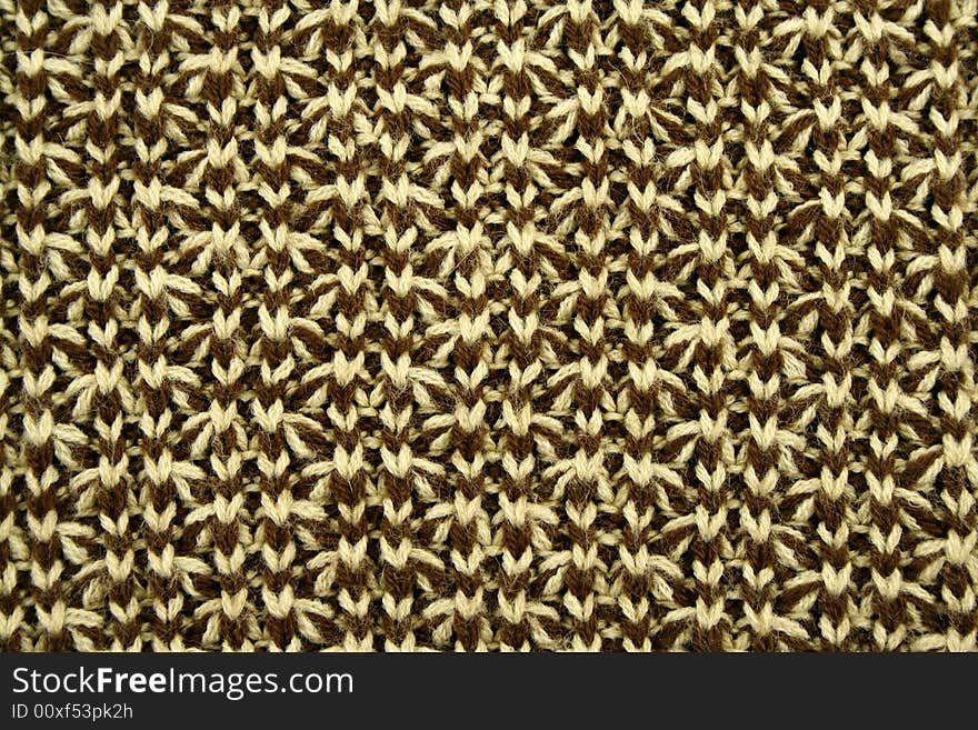 Texture of knitted green and beige cloth. Texture of knitted green and beige cloth