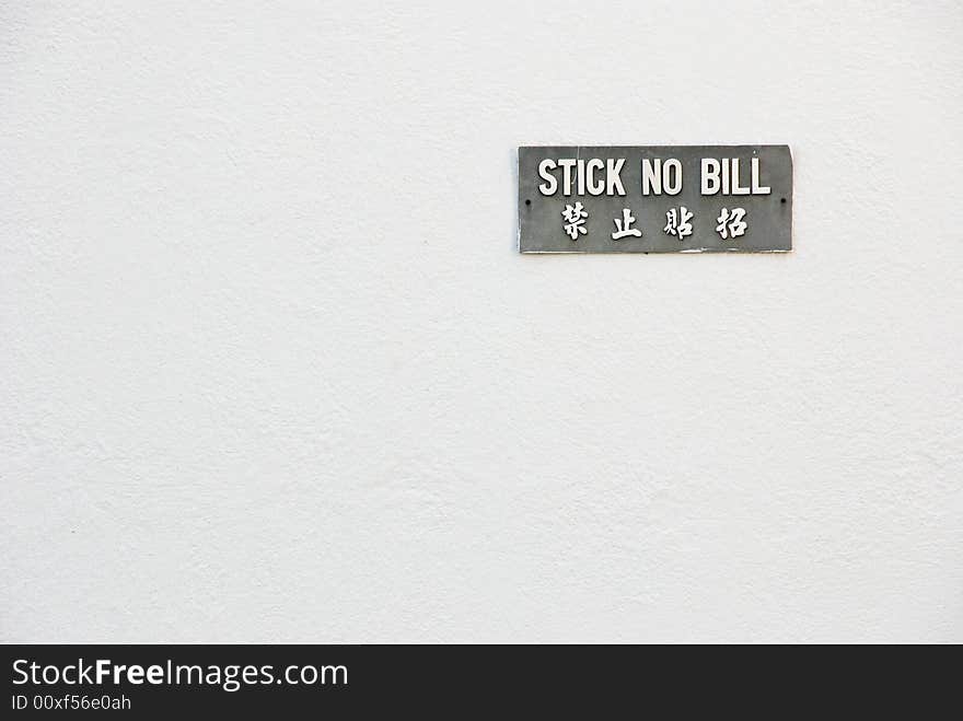 Sign on a white wall. Sign on a white wall