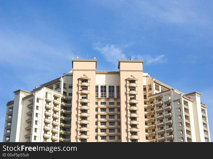 Apartment building with a bright blue sky