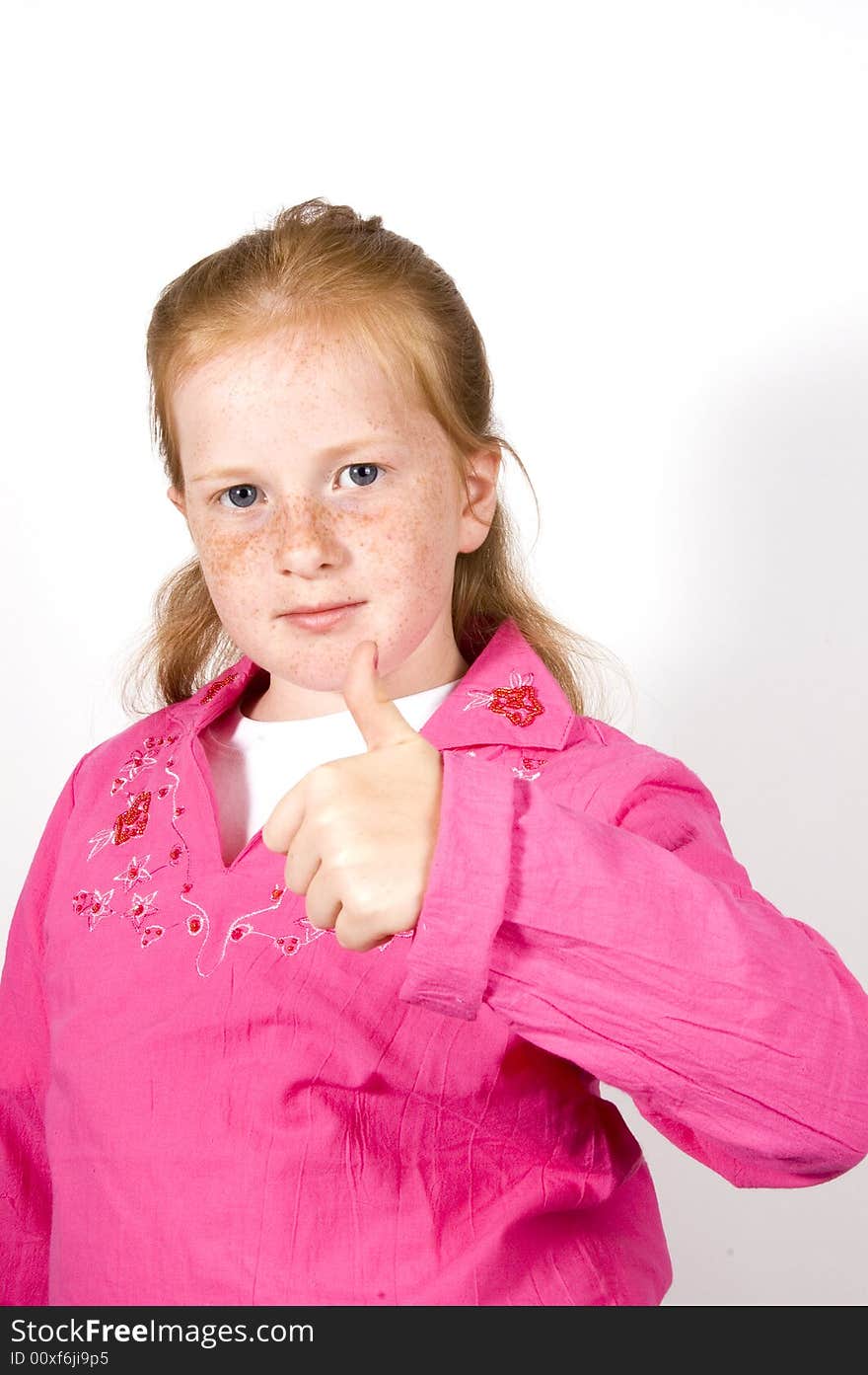 Cute little girl with thumb up