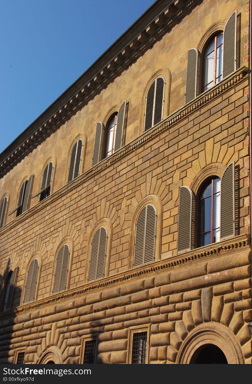 Red brick building wall in Italy, Europe. Vertical.