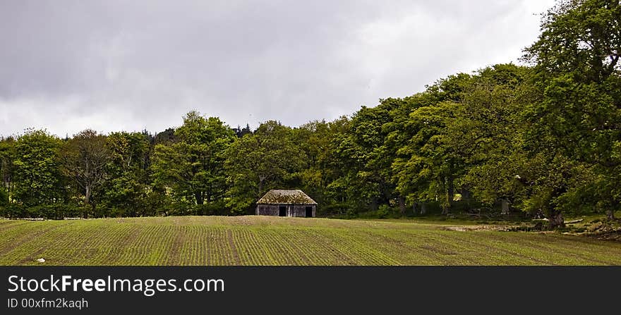 Ploughed field with a house. A plough is a large tool used for farming. A farmer drives or pulls a plough across a field to prepare it for planting. The large blades of a plough break up the earth, cutting and turning it so it&#x27;s loose and ready to be planted with seeds. When you operate a plough, you can say that you plough. Ploughs are used to break up hard soil, to cultivate plants, to roll soil over to incorporate plant matter into the soil, and to build terraces. The old days of ploughing with a mule or oxen were the same, the farmer would raise or lower the handles of the beam to force the plough deeper or raise it shallower. Ridge and furrow is a term used to describe the earthen ridges and troughs that are created by the action of prolonged ploughing, which caused the soil to build up in regularly spaced ridges along the length of a field. Typically, this was a method of cultivation characteristic of the medieval period and later. Ploughed field with a house. A plough is a large tool used for farming. A farmer drives or pulls a plough across a field to prepare it for planting. The large blades of a plough break up the earth, cutting and turning it so it&#x27;s loose and ready to be planted with seeds. When you operate a plough, you can say that you plough. Ploughs are used to break up hard soil, to cultivate plants, to roll soil over to incorporate plant matter into the soil, and to build terraces. The old days of ploughing with a mule or oxen were the same, the farmer would raise or lower the handles of the beam to force the plough deeper or raise it shallower. Ridge and furrow is a term used to describe the earthen ridges and troughs that are created by the action of prolonged ploughing, which caused the soil to build up in regularly spaced ridges along the length of a field. Typically, this was a method of cultivation characteristic of the medieval period and later.