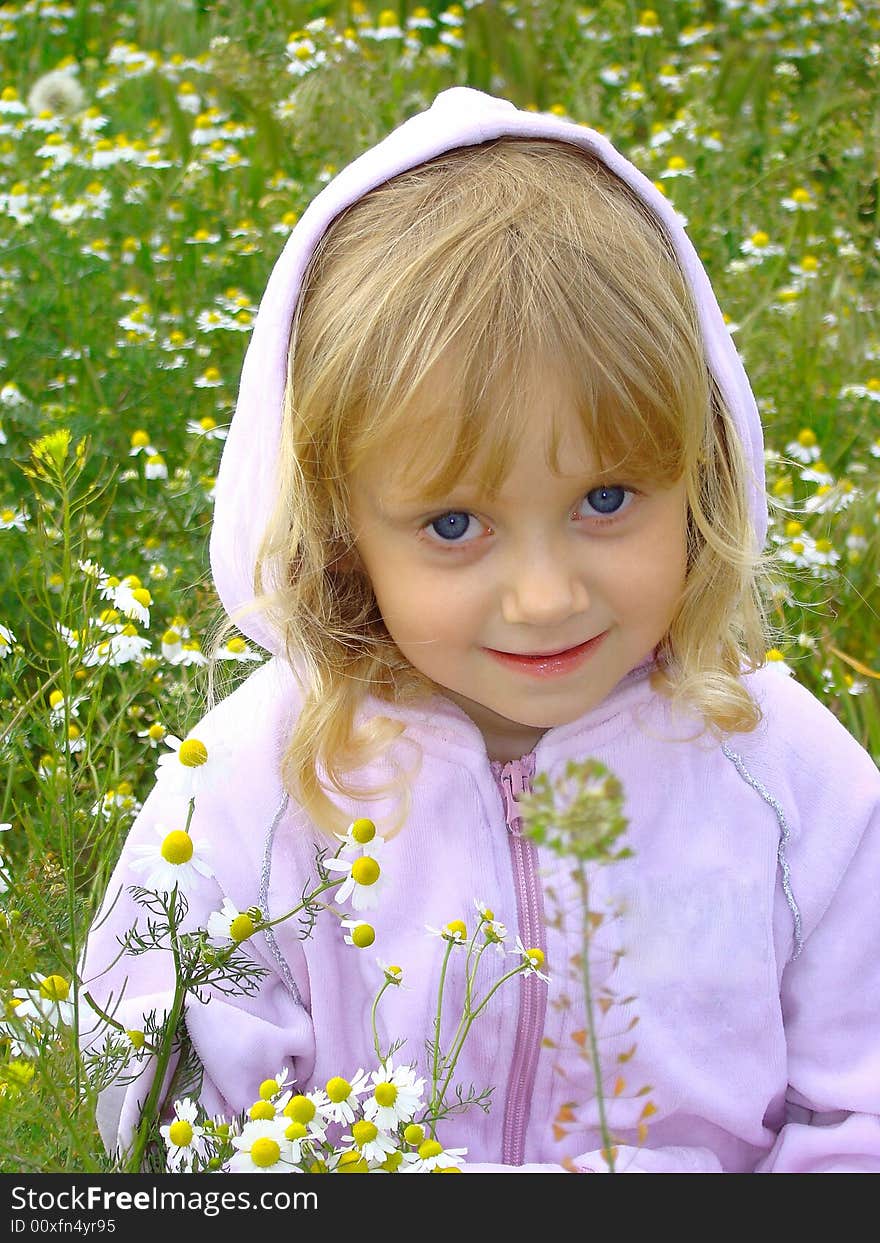 Little girl and flowers.