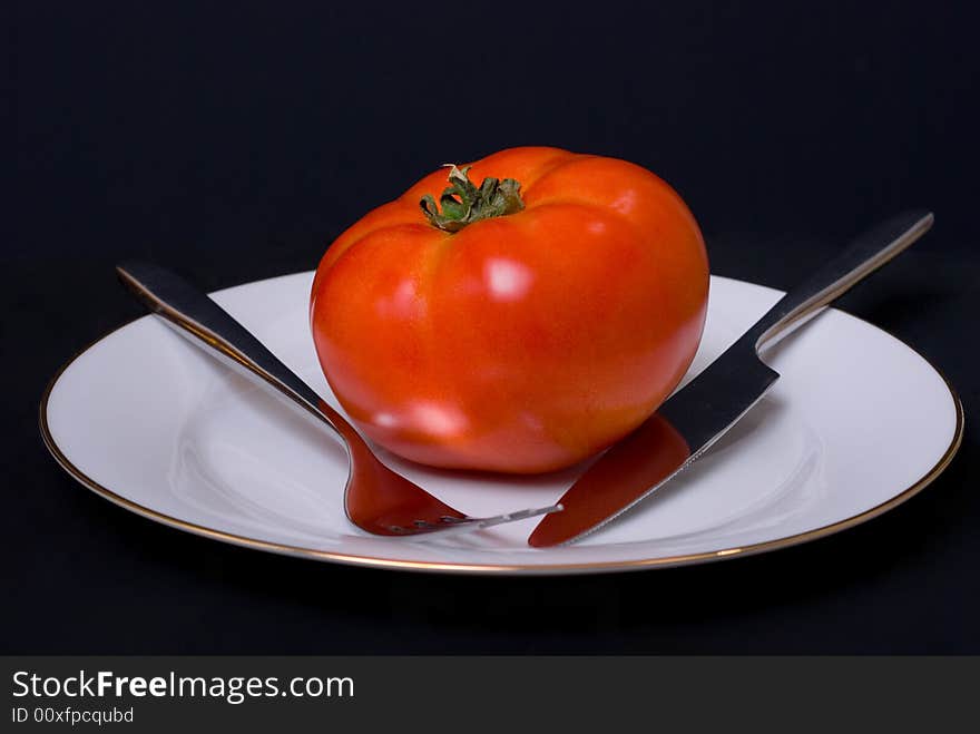 Tomato on the plate