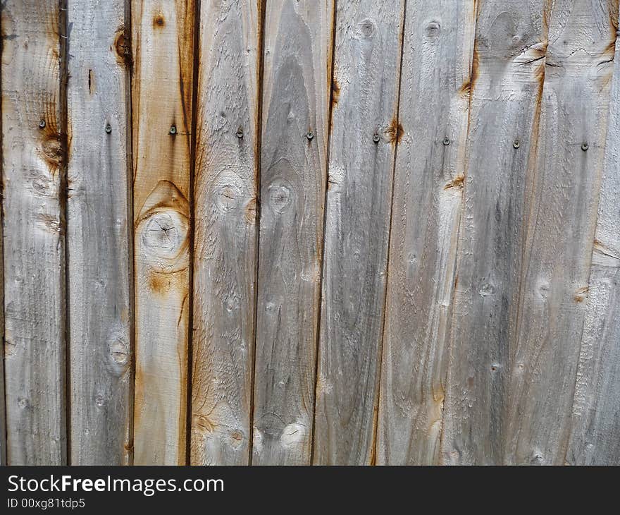 A close up image of a wooden fence, it would make a good texture background. A close up image of a wooden fence, it would make a good texture background.