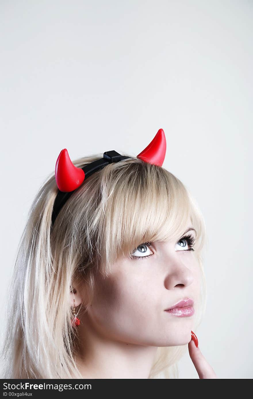 Beauty woman devil thinking at white background