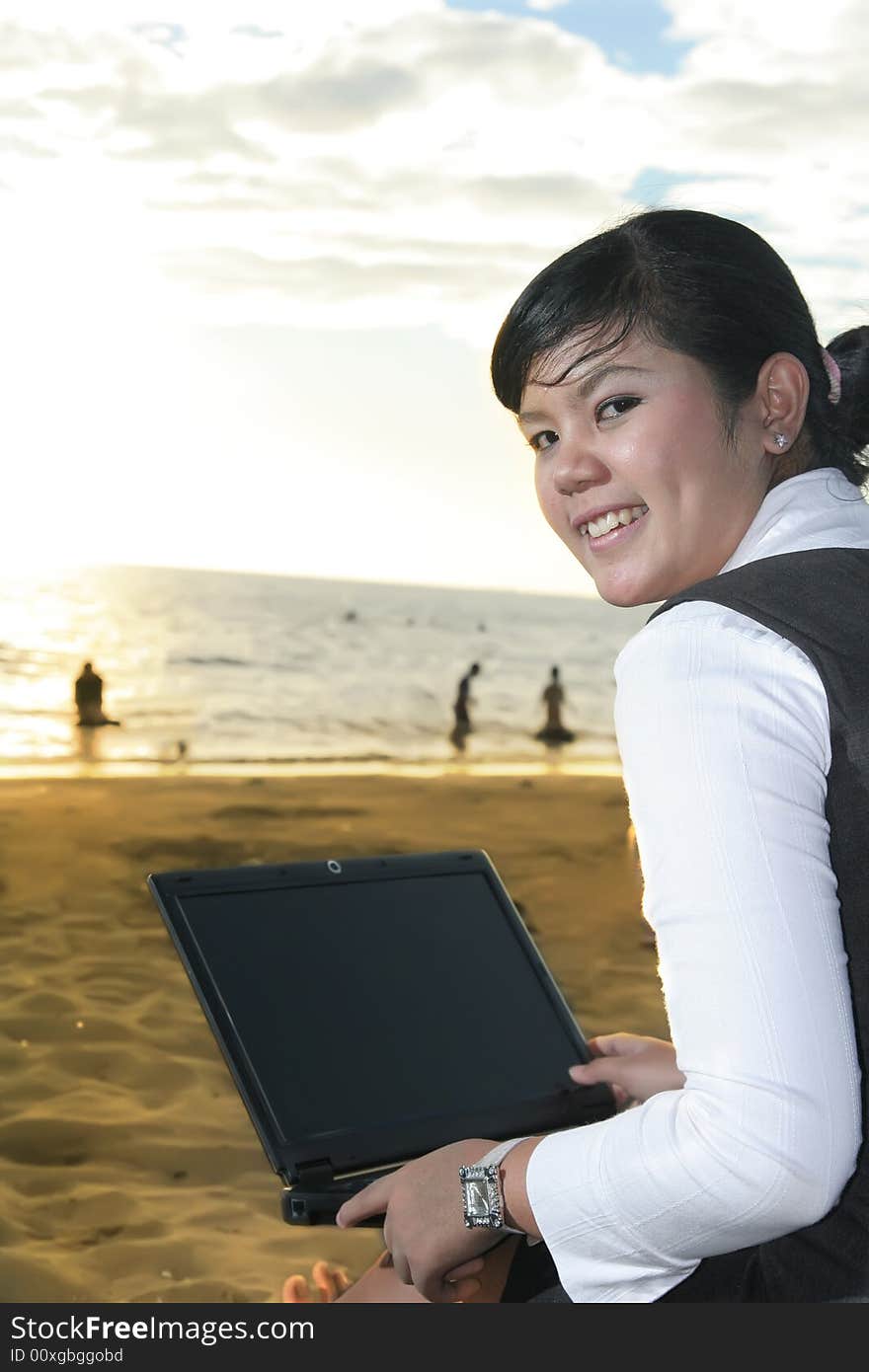 Business woman at sunset smiling