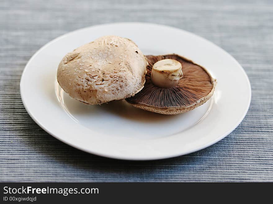 Fresh mushrooms on a white plate