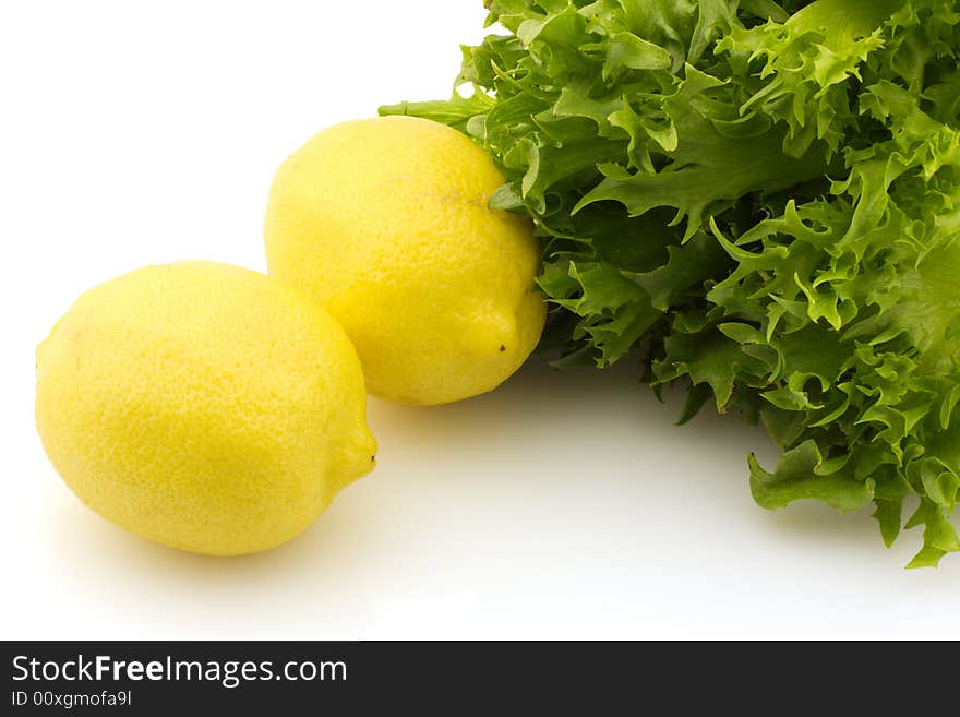 Two lemons and lettuce, isolated on white background. Two lemons and lettuce, isolated on white background