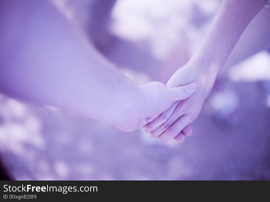 Closeup of man and woman holding hands. Closeup of man and woman holding hands