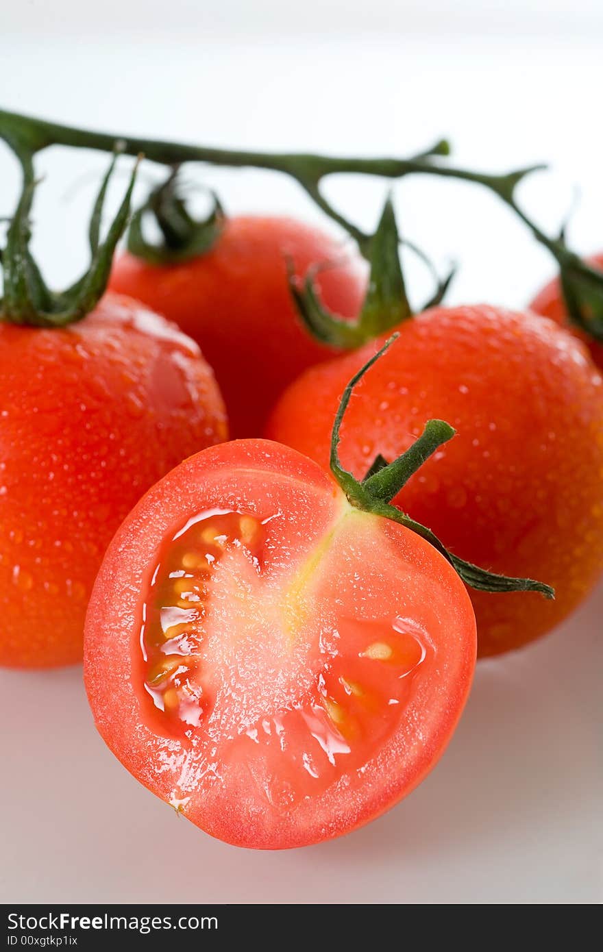 Fresh tomatoes, isolated on white