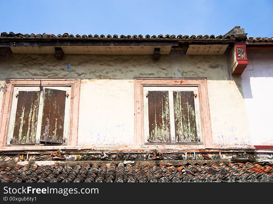 Chinatown architecture with wooden window shutters