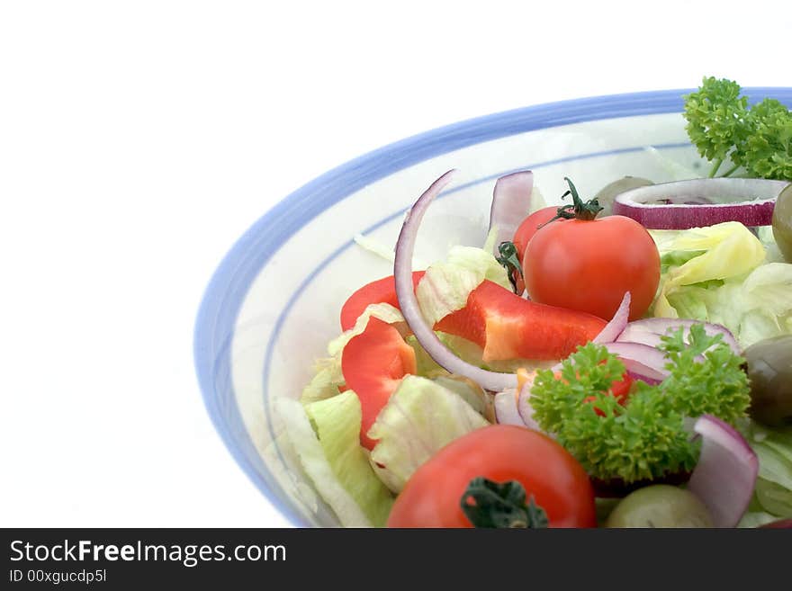 Italian salad in a bowl, against a white background. Italian salad in a bowl, against a white background