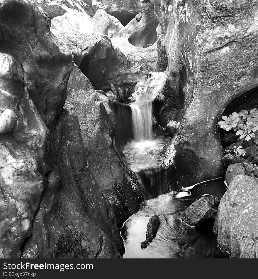 Waterfall In The Rocks