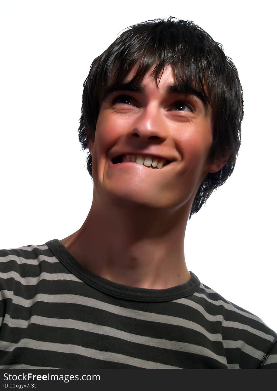 A portrait about a trendy attractive young man who is looking up and he is scared. He is wearing a striped t-shirt. A portrait about a trendy attractive young man who is looking up and he is scared. He is wearing a striped t-shirt.