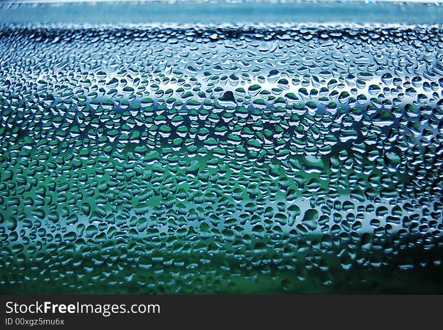 Raindrops creating wonderful aquamarine background. Raindrops creating wonderful aquamarine background