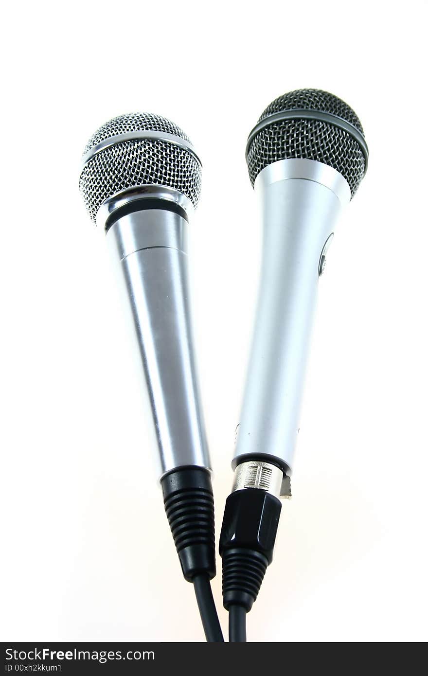 Two different microphones on white background