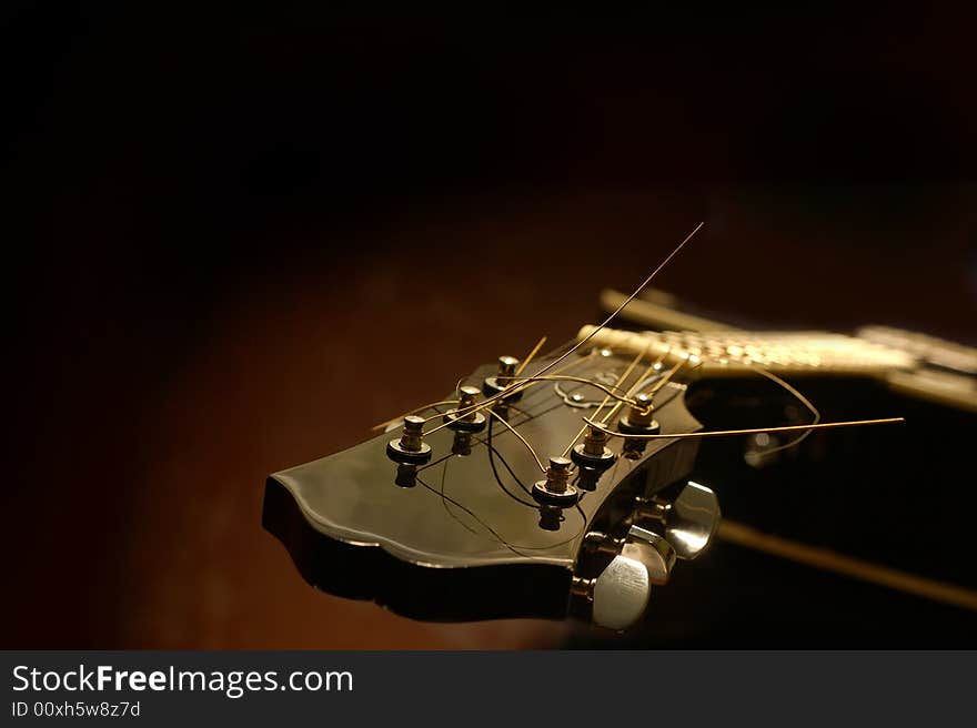 Acoustic guitar reflecting the light