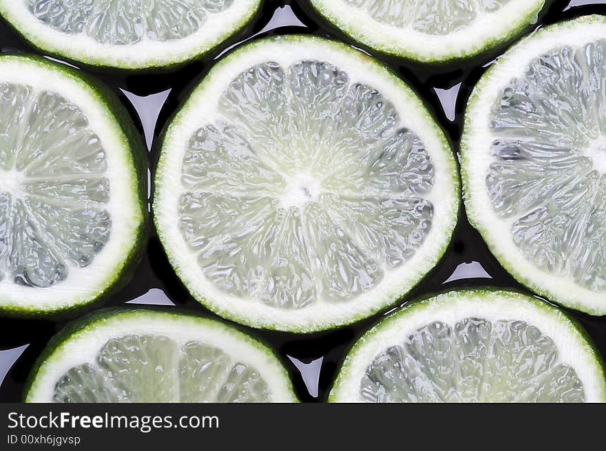 Green lemon on glass mirror