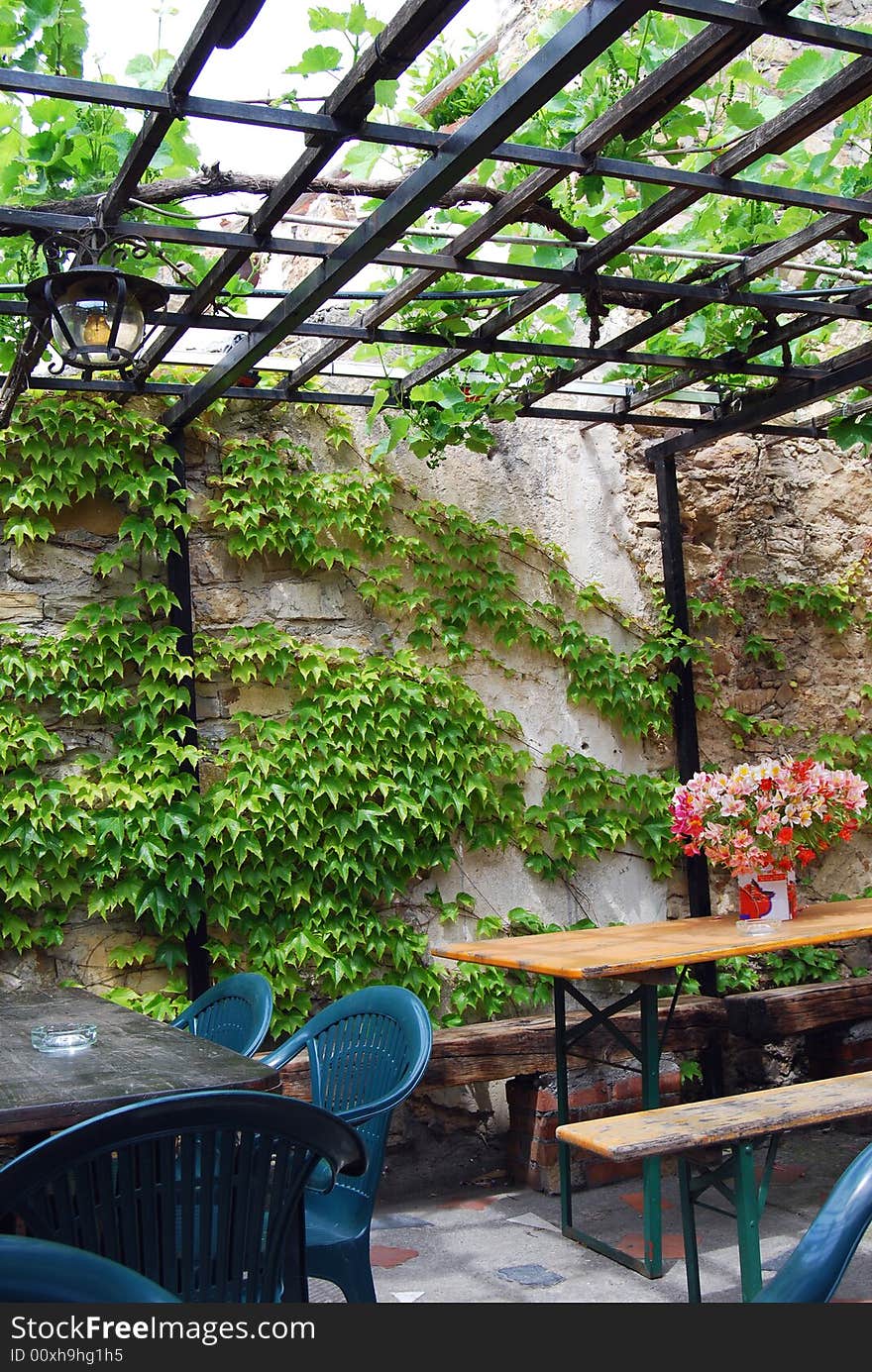 Chairs and tables with flowers in a typical restaurant in countryside