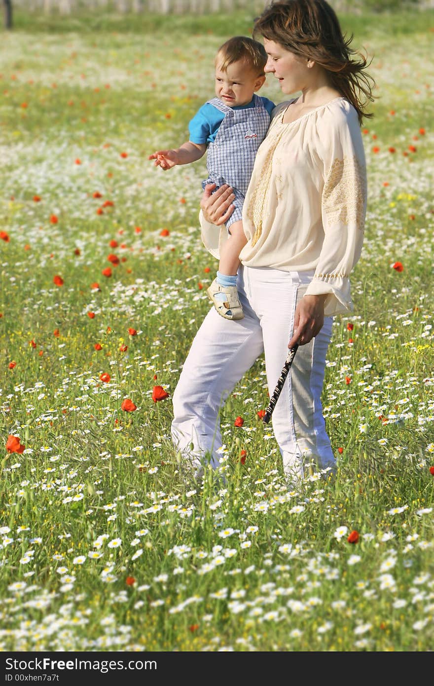 Mother and son walking through flowers