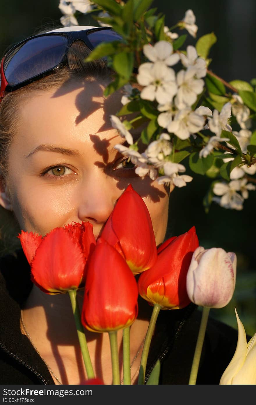 The girl with a bouquet of tulips