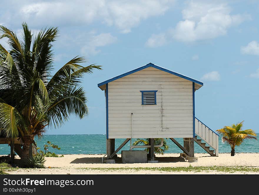 A wooden lodge called cabaňa on a beach in Belize. A wooden lodge called cabaňa on a beach in Belize