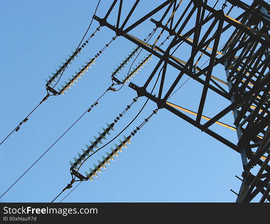 Power transmission line on a background of the blue sky. Power transmission line on a background of the blue sky