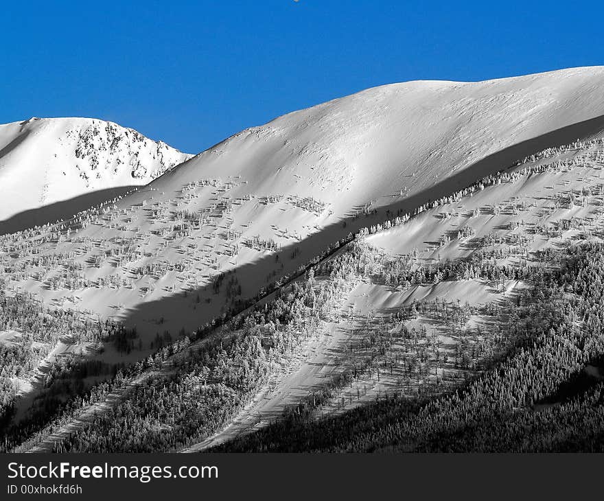 Mountains in winter with blue sky