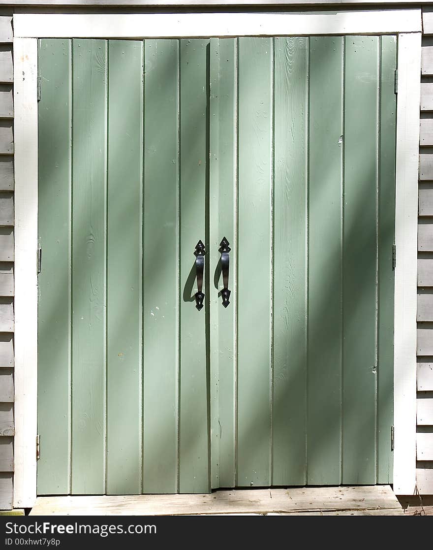 Black Iron Handles on a Green Door. Black Iron Handles on a Green Door