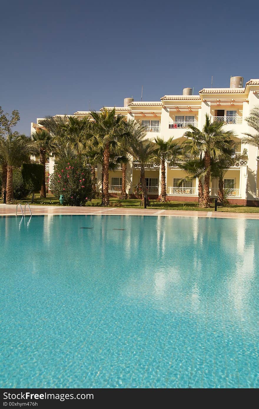 Swimming pool in a tropical resort hotel