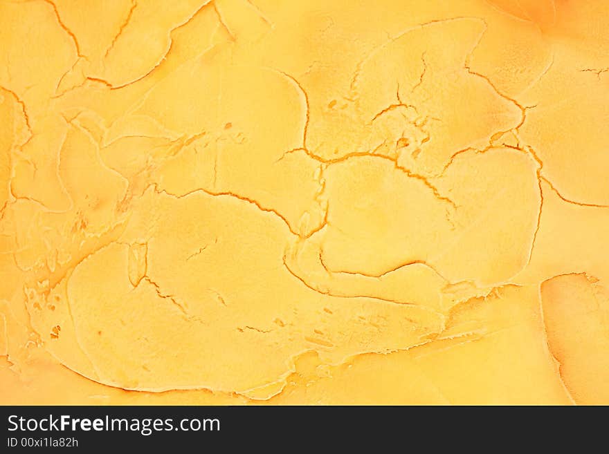 Yellow painted background with cracks