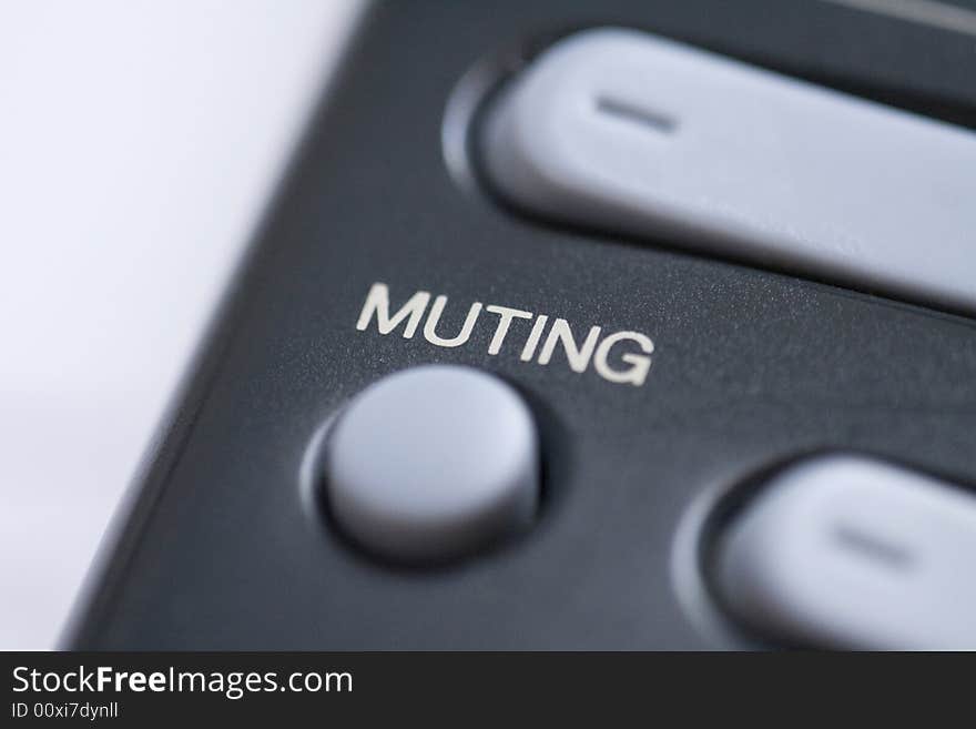 Close up of a mute button on a remote control