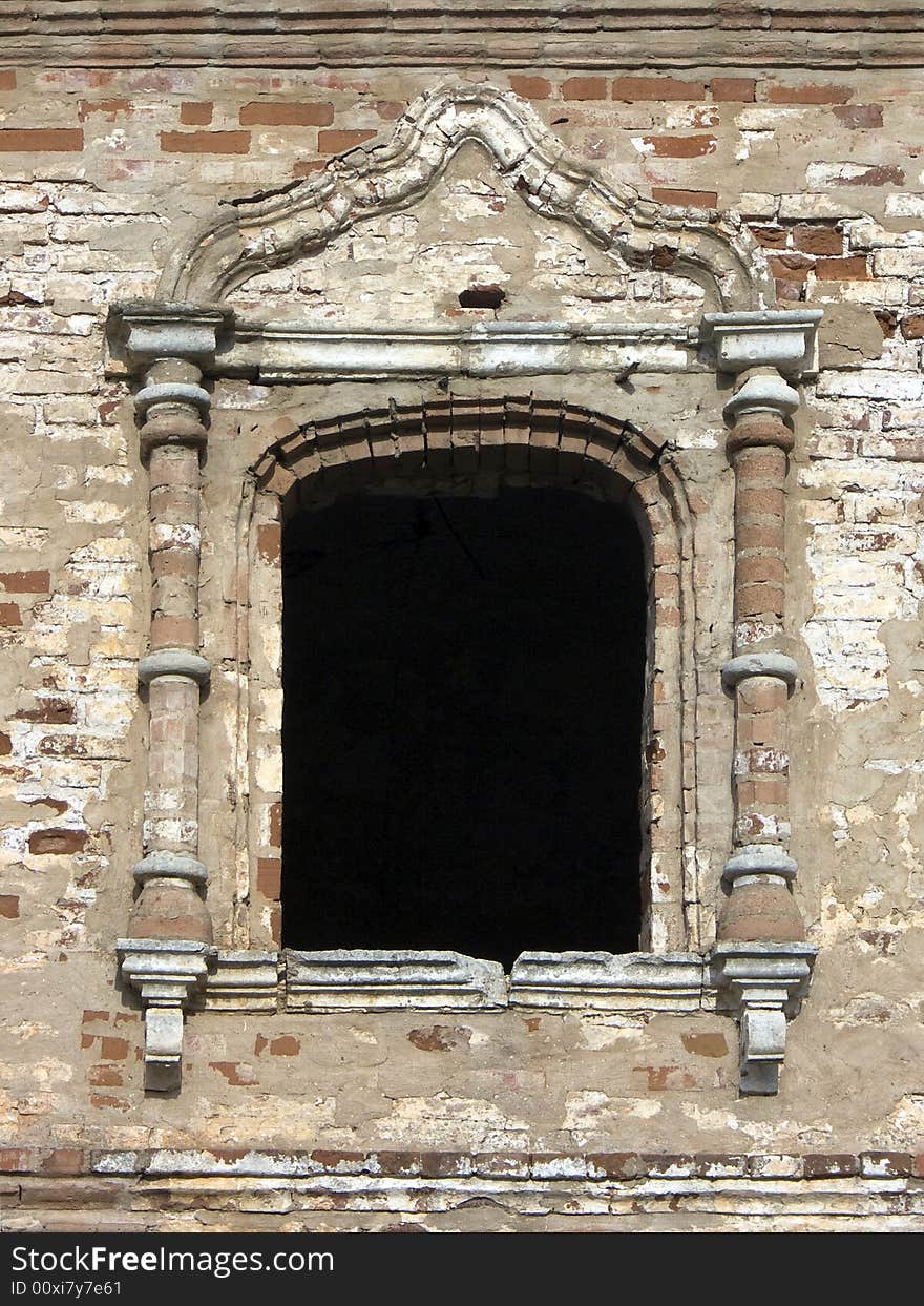 Old window in a wall of a monastery. Old window in a wall of a monastery