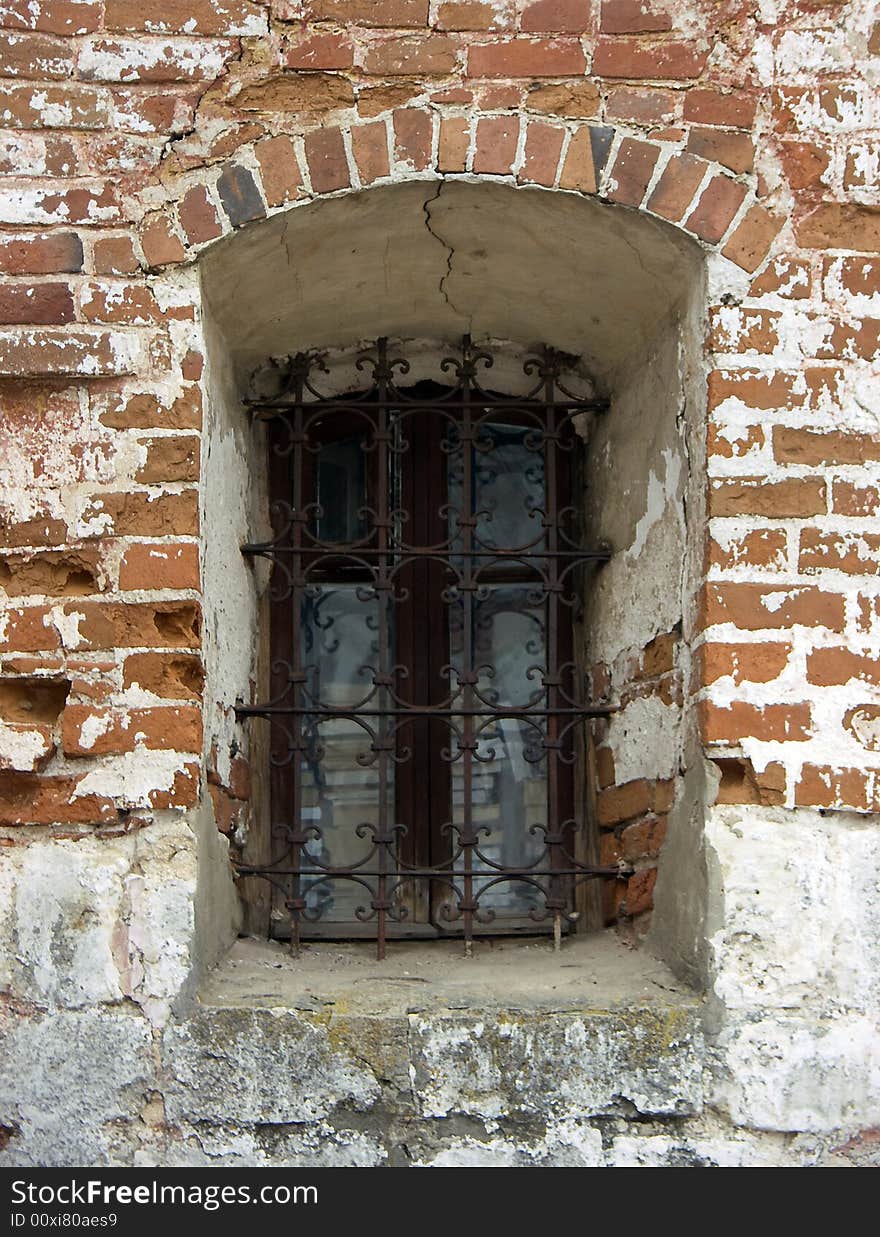 Old window in a wall of a church. Old window in a wall of a church