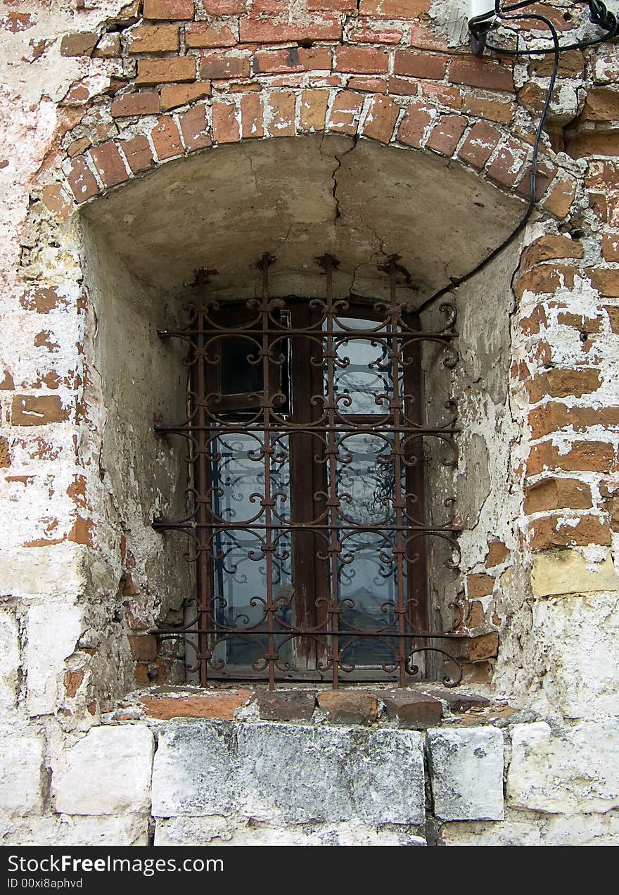 Old window in a wall of a church. Old window in a wall of a church