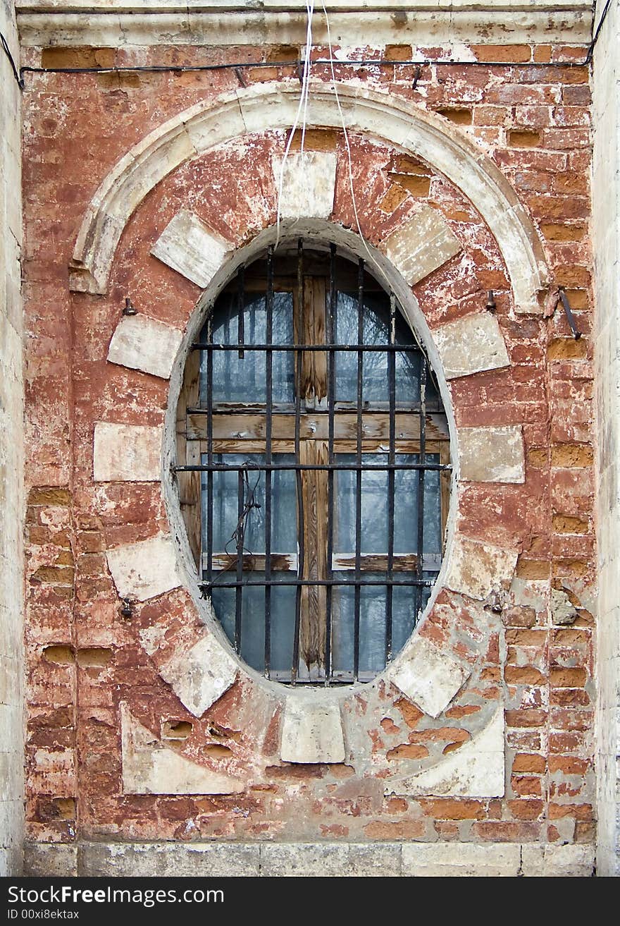 Old window in a wall of a church. Old window in a wall of a church