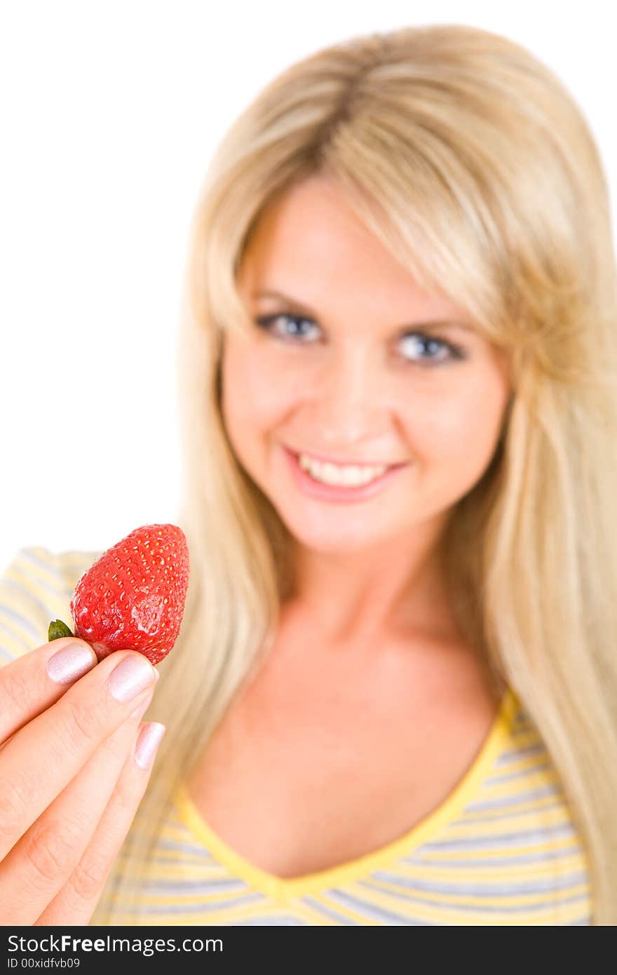 Tasty strawberry in hands of the long haired beauty. Tasty strawberry in hands of the long haired beauty