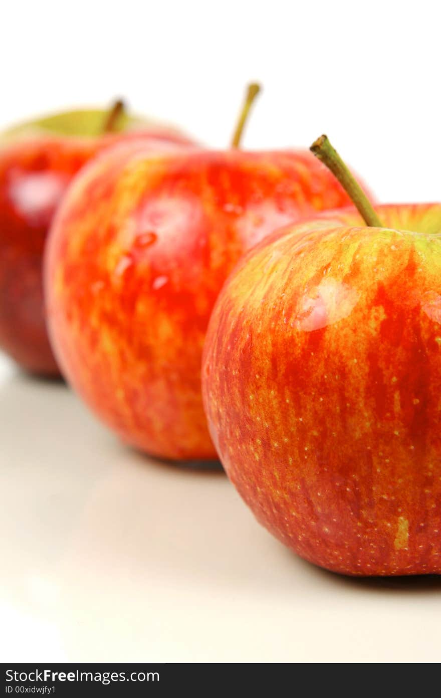 Red apples isolated against a white background