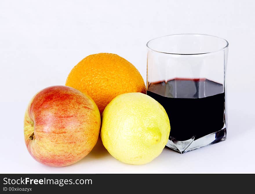 Red wine with an apple, lemon and orange. Red wine with an apple, lemon and orange